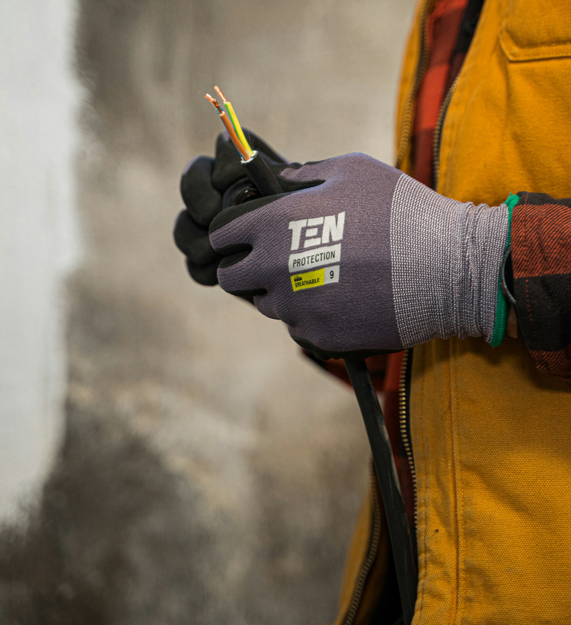 Image of an electrician splicing wires