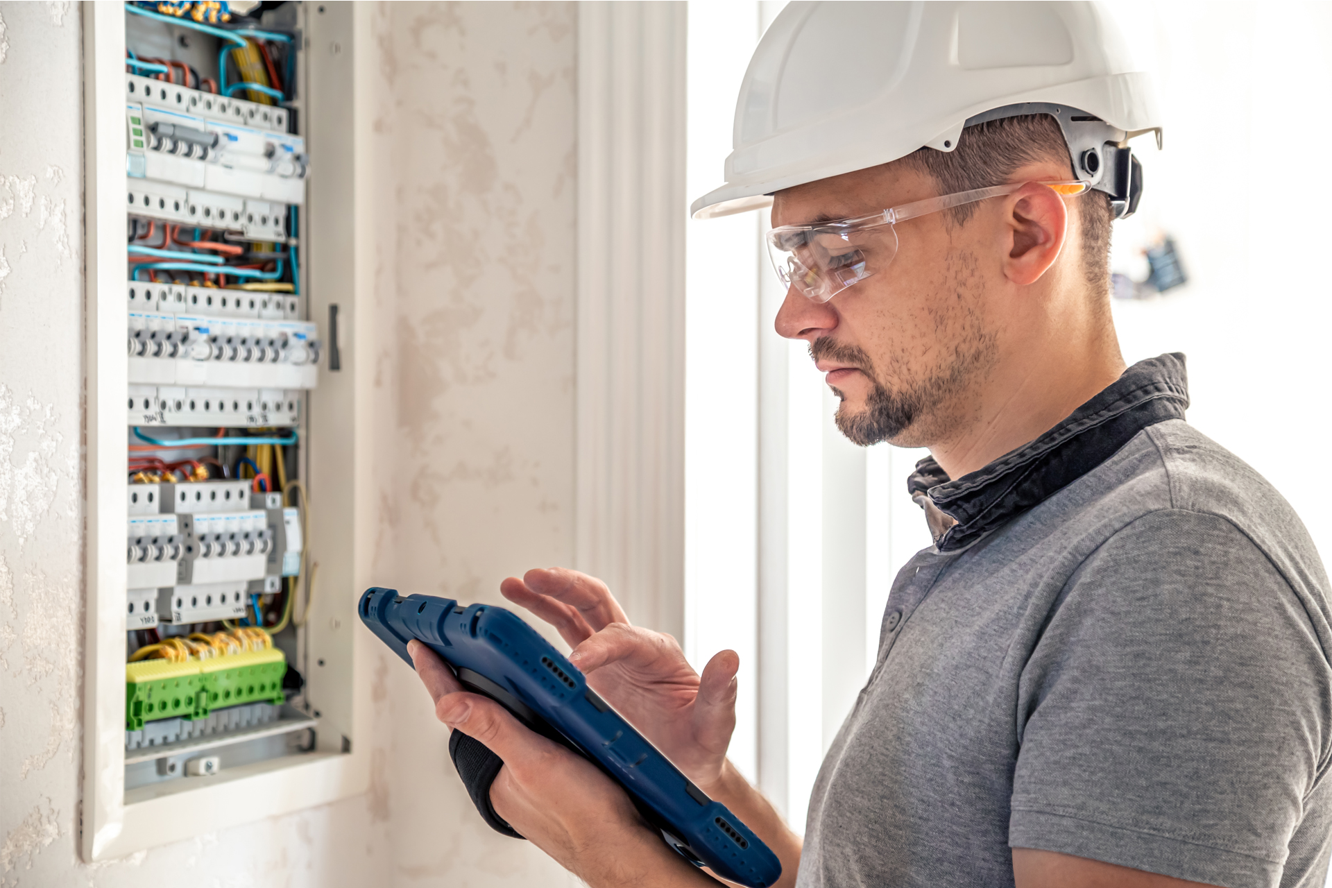 Image of an electrical worker preforming engineering