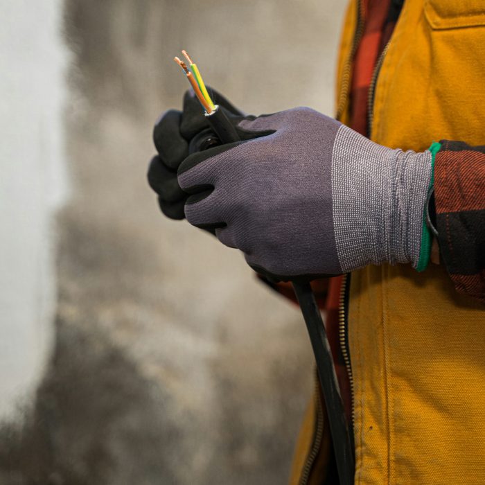Image of an electrician splicing wires