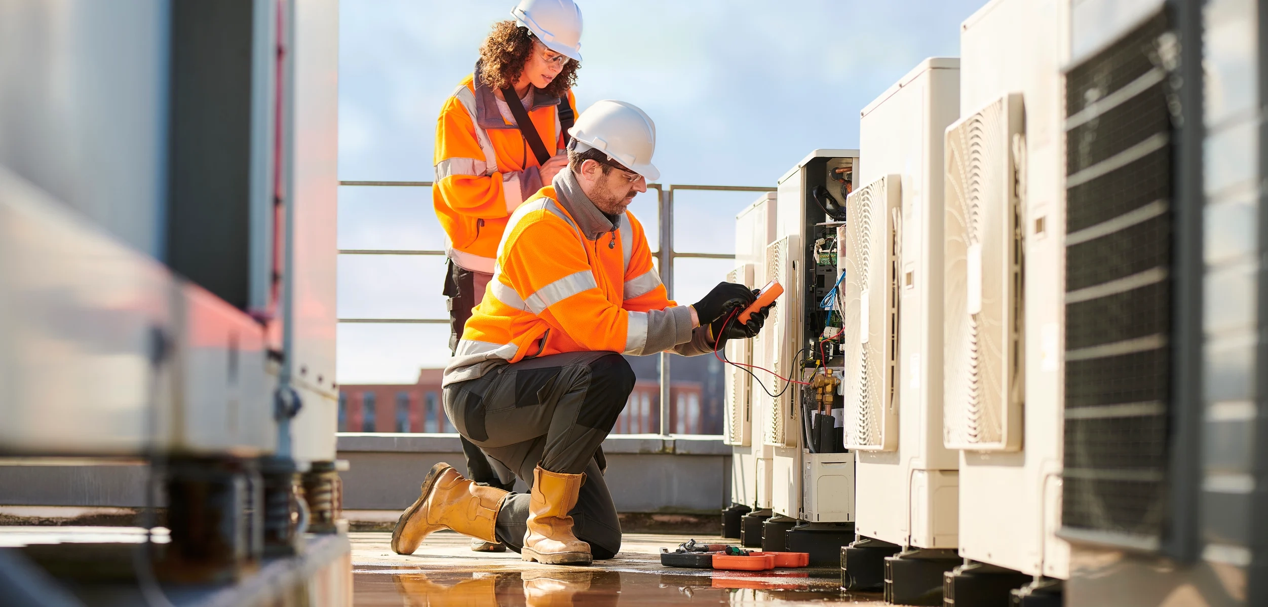 electricians repairing unit.
